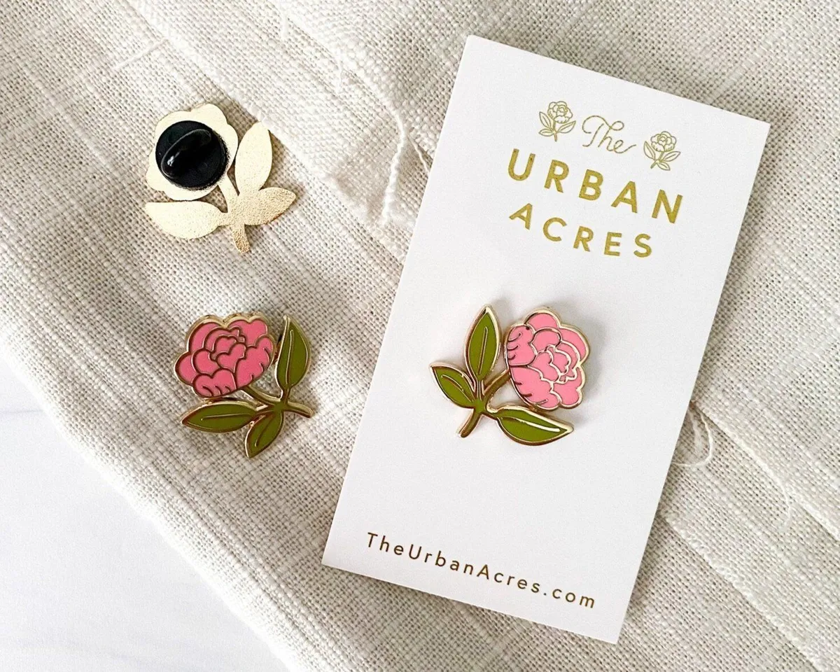 Enamel flower pins on a branded card